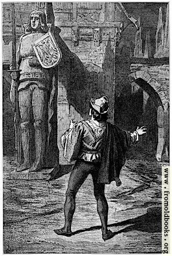 [Picture: A giant wooden statue of a warrior with shield and sword]