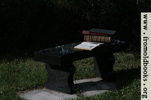 Stone bench with books 1