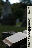 [picture: Open Bible and cross in graveyard]