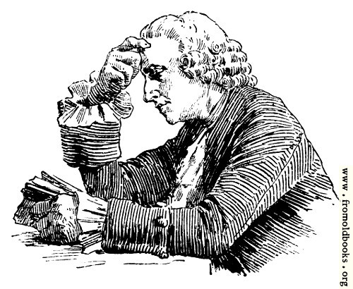 [Picture: Man reading at a table]