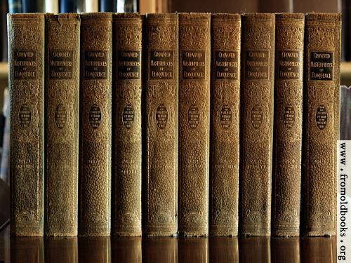 [Picture: Green and Gold books on polished wood]